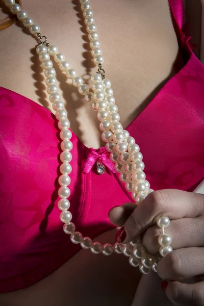 Red bra with pearls — Stock Photo, Image