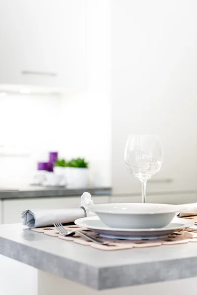 Modern kitchen interior with glass and plate — Stock Photo, Image