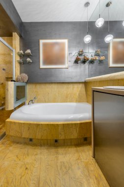 Stylish and expensive bathroom interior design with yellow marble finishing
