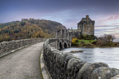 Eilean Donan Castle in Dornie in the Scottish Highlands during cloudy day, Scotland clipart