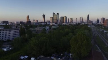 Aerial panorama of Warsaw city during sunset. View from Warsaw West train station side.