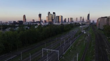 Aerial panorama of Warsaw city during sunset. View from Warsaw West train station side.