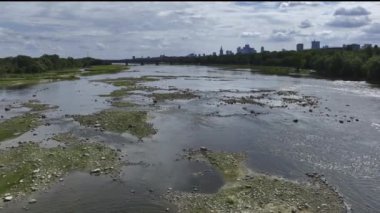 Warsaw city panorama over the Vistula river in summer time with low water level