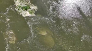 Warsaw city panorama over the Vistula river in summer time with low water level