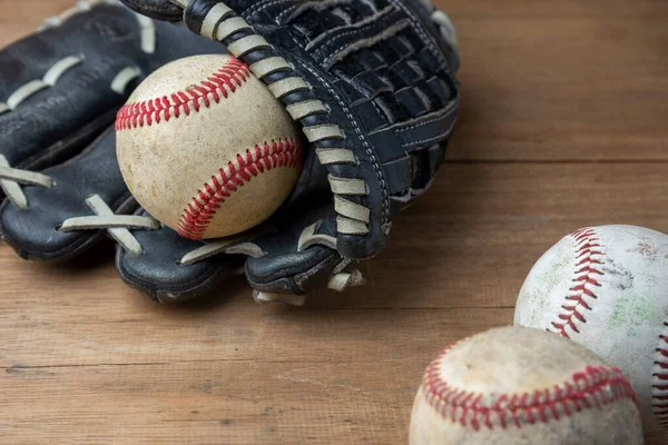 Vintage classic leather baseball glove and baseball ball isolated on white background