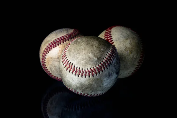 Baseball ball on black background. American traditional sports game.