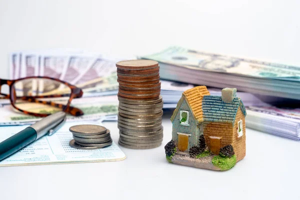 Saving money for real estate. Coin stack Saving plan to buy property, house. Personal financial concept for own a house.