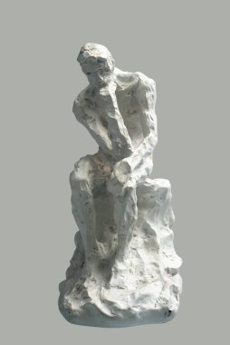 Sculpture Thinker. A man sits with his hands on his chin. Close up.
