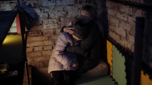 War in Ukraine. Gunning of civilians. Ukrainian mom and baby in a bomb shelter. Bombardment. Military action. Stop war. Crisis in Ukraine, aggression, child against war. No War. — Stock Video