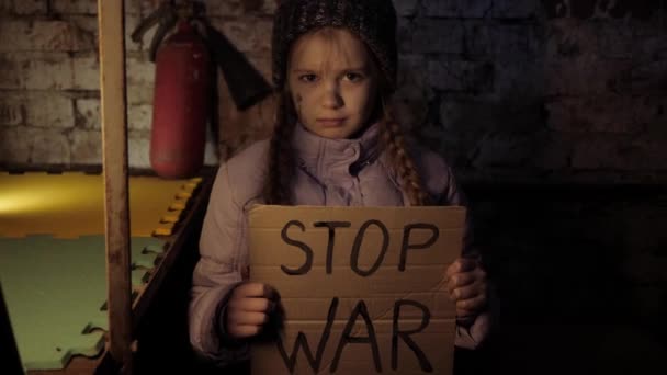 War in Ukraine. Bomb shelter. Stop war. Gunning of civilians. Ukrainian in a bomb shelter Bombardment. Military action. Crisis in Ukraine, aggression, child against war. — Stock Video
