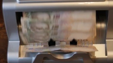 Automated banking equipment for counting paper money. Currency counter Credit and deposit offer. Currency exchange, banking. Business finance concept.