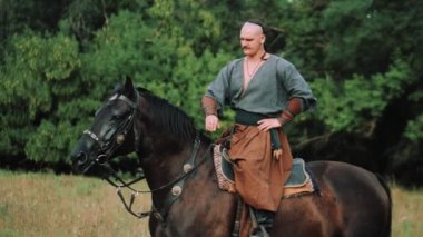 Zaporozhye Cossack on horseback. Ukrainian Cossack in the Zaporozhian Sich. Strong people. Patriots of their country.