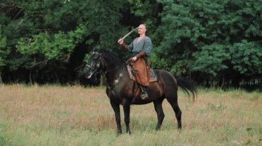 Zaporozhye Cossack on horseback. Ukrainian Cossack in the Zaporozhian Sich. Strong people. Patriots of their country.