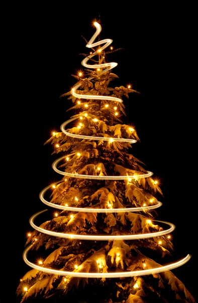 Christmas tree with light spiral drawn around it — Stock Photo, Image