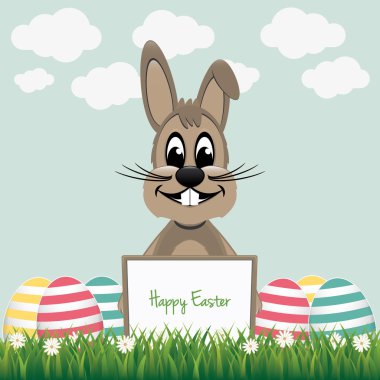 tahta renkli yumurta arkasındaki kahverengi tavşan