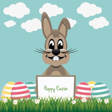 tahta renkli yumurta arkasındaki kahverengi tavşan