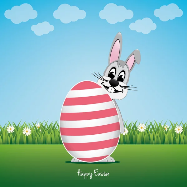 Happy bunny behind big egg daisy meadow — Stock Vector