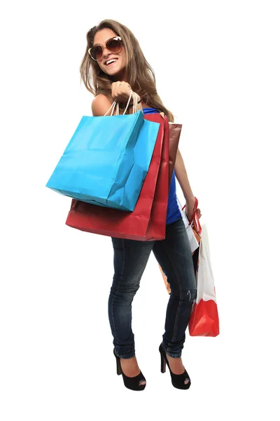 Chica joven hacer compras con un montón de bolsas de compras — Foto de Stock