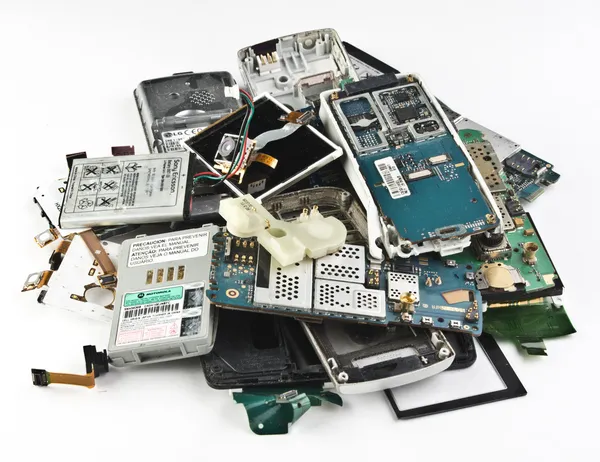 Broken cell phones, dumped a bunch. Stock Photo