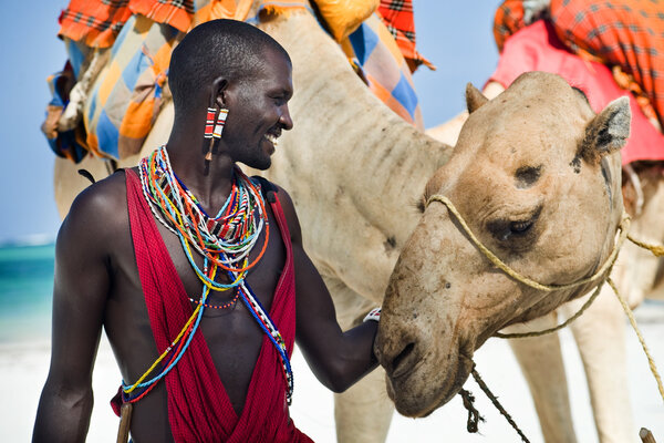 Maasai sitting by the ocean