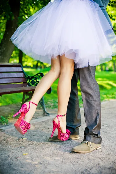 Legs of the groom and the bride. — Stock Photo, Image