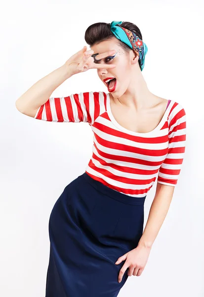 Funny pin-up woman with fingers on eyes — Stock Photo, Image