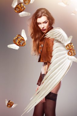 attractive sexy woman with wings and flying masks clipart