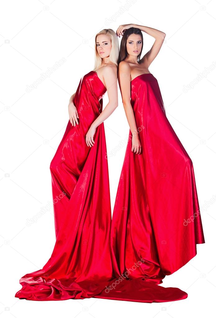 Two women in long red dress standing back to back Stock Photo by ...