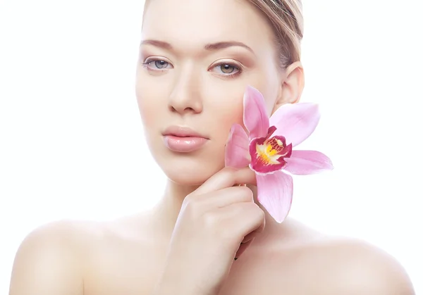 Young shiny woman with pink flower — Stock Photo, Image