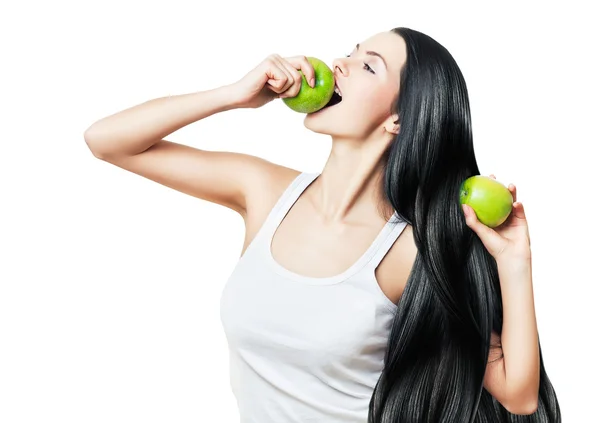 Mujer con manzanas verdes y cabello largo — Foto de Stock