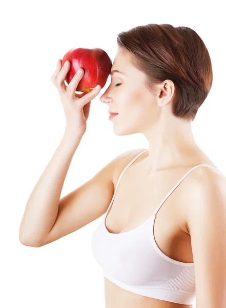 Mujer pensativa con manzana roja — Foto de Stock