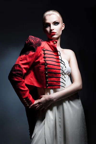 Blonde sexy woman in red jacket and white dress — Stock Photo, Image