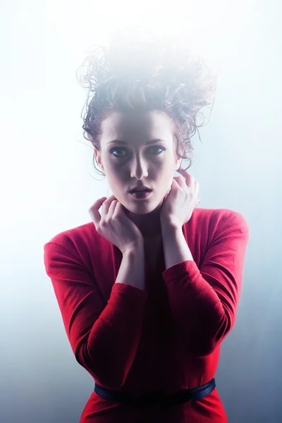 Woman in red and pink with high curly hairstyle — Stock Photo, Image