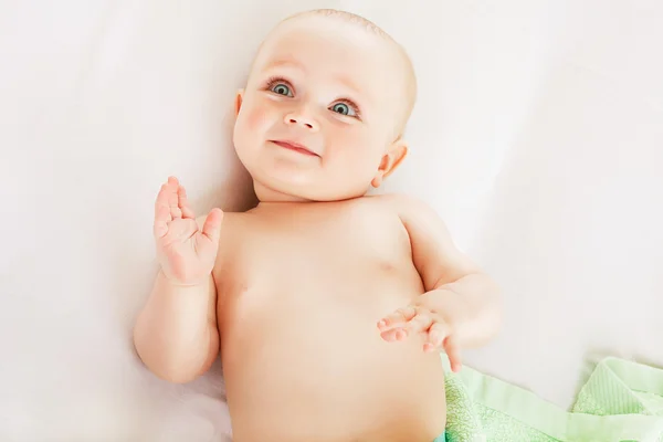 Cute child on white fabric — Stock Photo, Image