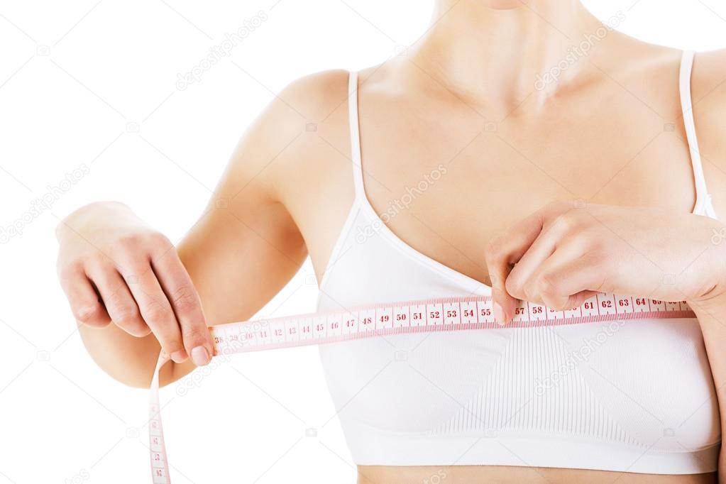 woman measuring her bust