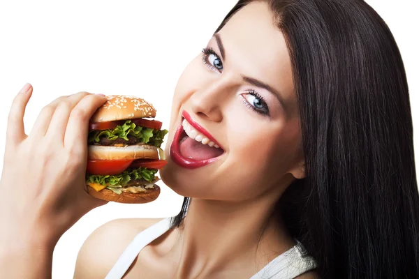 Happy cute woman eating hamburger — Stock Photo, Image