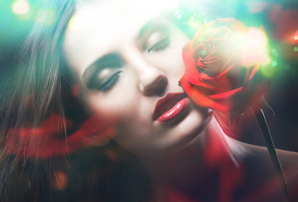 Brunette woman with red rose and green light