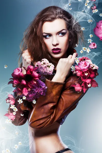 Pretty attractive erotic woman in brown jacket with flowers — Stock Photo, Image