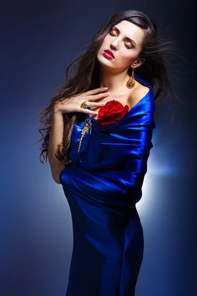 Art portrait of a beautiful woman in blue dress — Stock Photo, Image