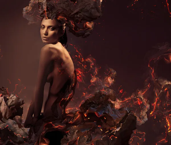 Sexy attractive nude woman in burning ashes — Stock Photo, Image