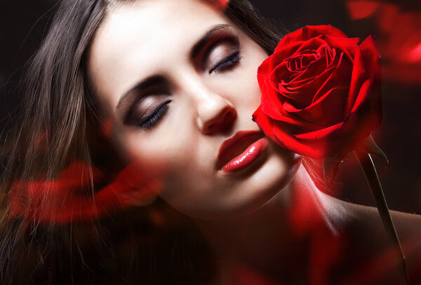 Brunette woman with red rose
