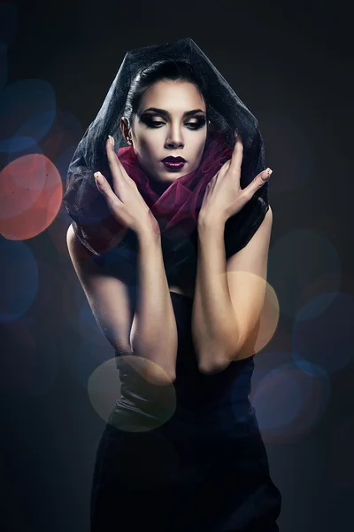 Attractive beautiful woman in black hood — Stock Photo, Image