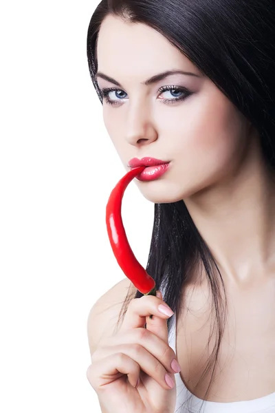 Sexy brunette woman with chili pepper — Stock Photo, Image