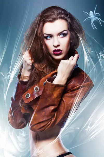 Pretty attractive erotic woman in brown jacket with spider — Stock Photo, Image