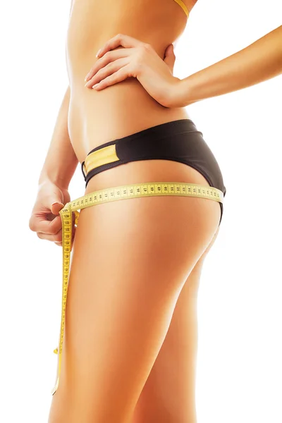 Cuidado do corpo da mulher e medida amarela — Fotografia de Stock
