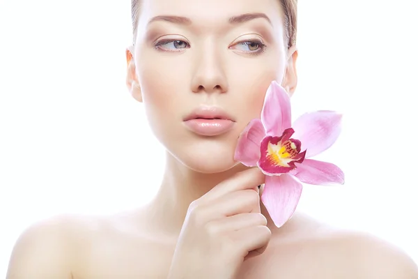 Young woman with pink flower — Stock Photo, Image