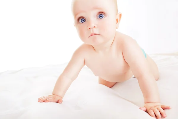 Interested child on white fabric — Stock Photo, Image