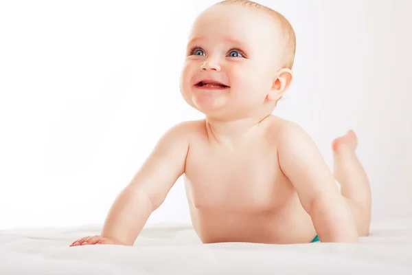 Positive child on white fabric — Stock Photo, Image