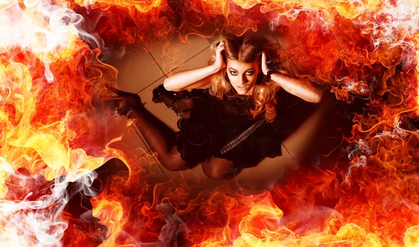 Young woman in fire — Stock Photo, Image