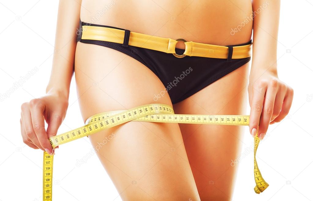 yellow measure on woman leg